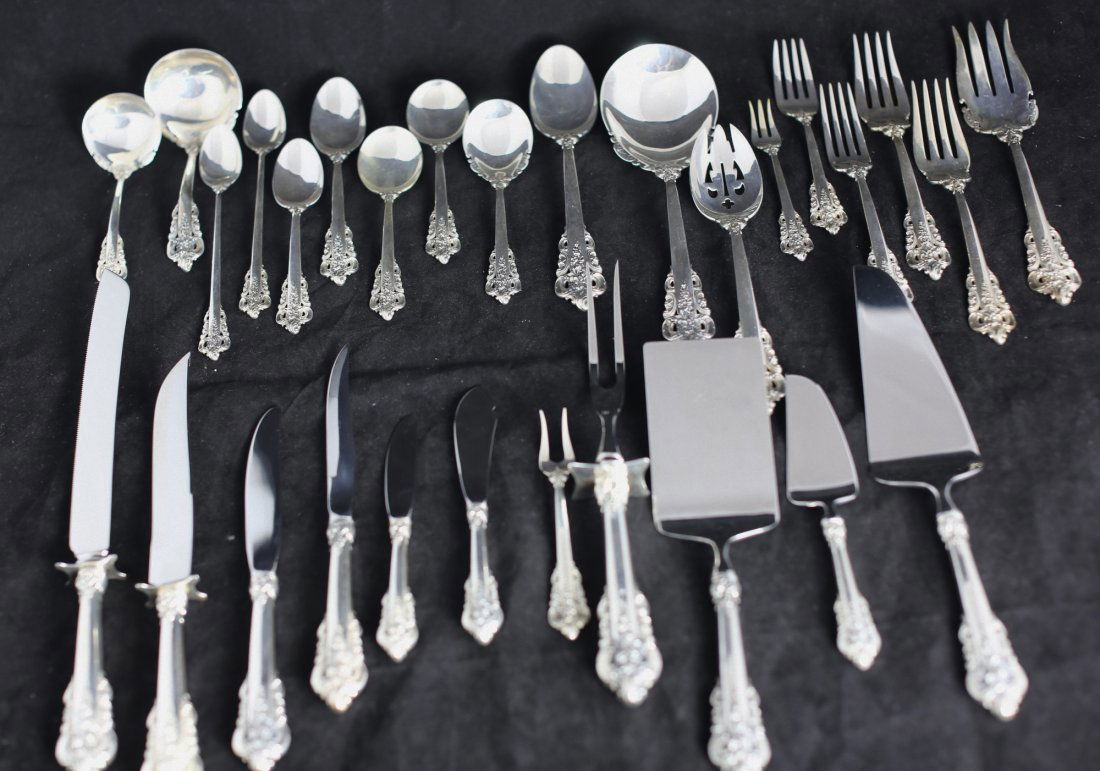 251 PIECE “GRAND BAROQUE“ SILVER FLATWARE SET: 251 PIECE “GRAND BAROQUE “ SILVER FLATWARE SET. Introduced in 1941, Maker: Wallace Silversmiths. Comprising:20 Steak knives 19 forks 20 Seafood forks 20 Soup spoons 20 Bouillon spoons 20 Coffee /