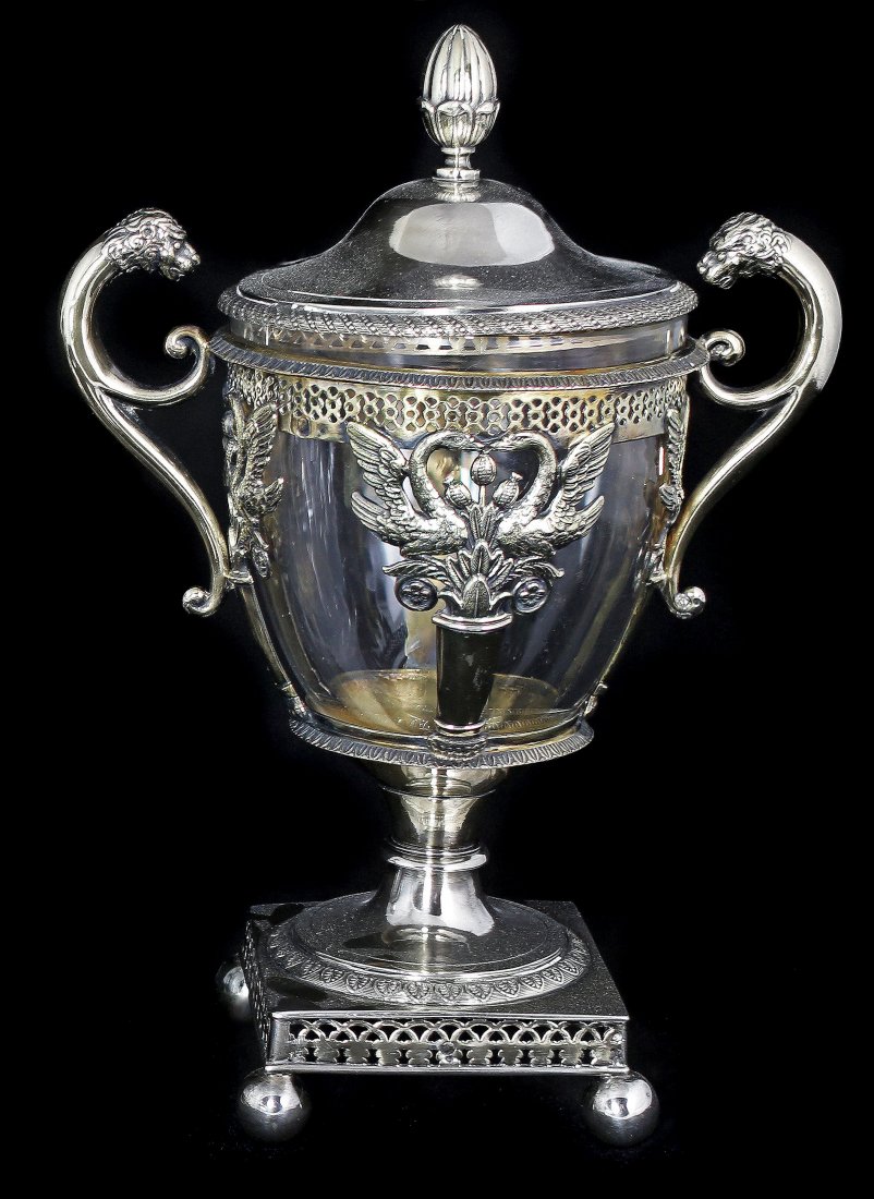 FRENCH SILVER BOMBONIERE AND COVER (19th CENTURY): FRENCH SILVER BOMBONIERE AND COVER,19th Century Flanked by lion heads and double scroll handles, the open sides fitted with a removable glass liner, raised on a square shaped base. Height 8 ½ in. Wei
