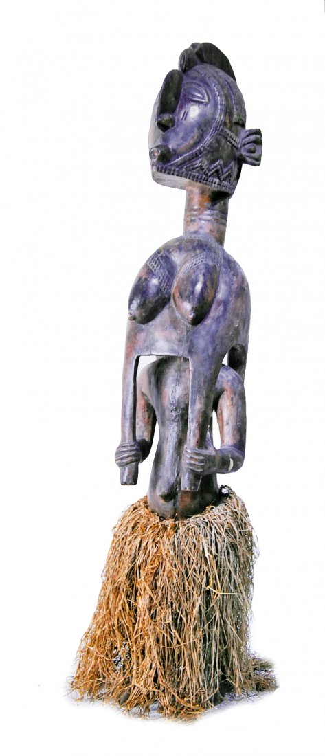 BAGA PEOPLE GUINEA: Property of Lynn University to benefit the Library Renovation Fund BAGA PEOPLE GUINEA Hand carved wood totem brown-black encrusted patina in the form of a male figure standing, wearing a Nimba mask/he