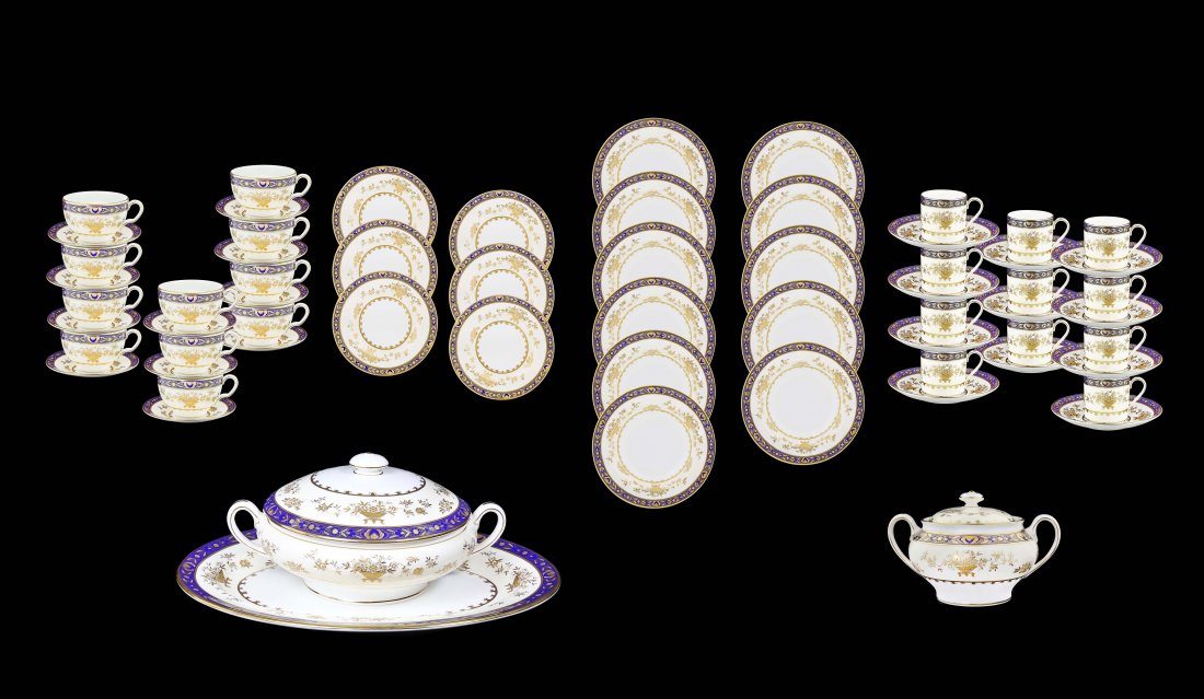 AN EXTENSIVE MINTONS BONE CHINA DINNER SERVICE: Property of an East Coast Lady An extensive Mintons Bone China, (Made in England) dinner service, 20th Century Each piece painted with a loose bouquet of colorful garden flowers within a gilt-edged co
