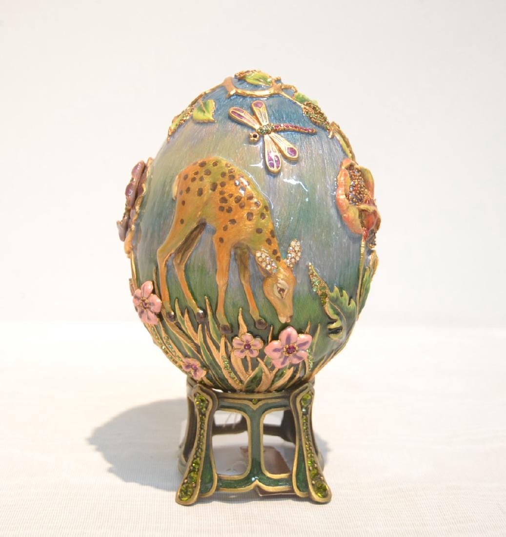 JAY STRONGWATER ENAMELED BRONZE MEADOW EGG: ON STAND ; FLORA COLOR , WITH SWAROVSKI CRYSTALS ADORNED WITH DEER , RABBIT, BIRD, FROG, DRAGONFLY & BUTTERFLY ' LIMITED EDITION 70/350 ; ARTIST SIGNED - 3 1/2" x 6 1/2"