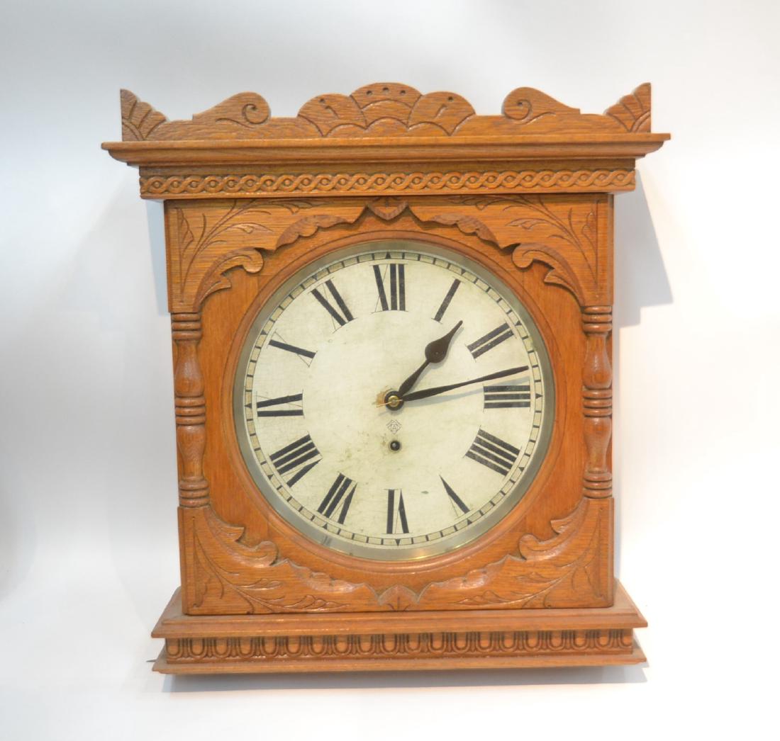 CARVED OAK ANSONIA WALL CLOCK: 19" x 6" x 22"