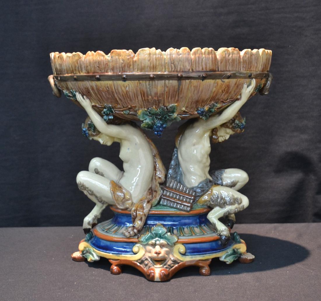 MAJOLICA MYTHOLOGICAL CENTERPIECE: WITH (2) HOOF FOOT MEN HOLDING BOWL - 12" x 8 1/2" x 11 1/2"