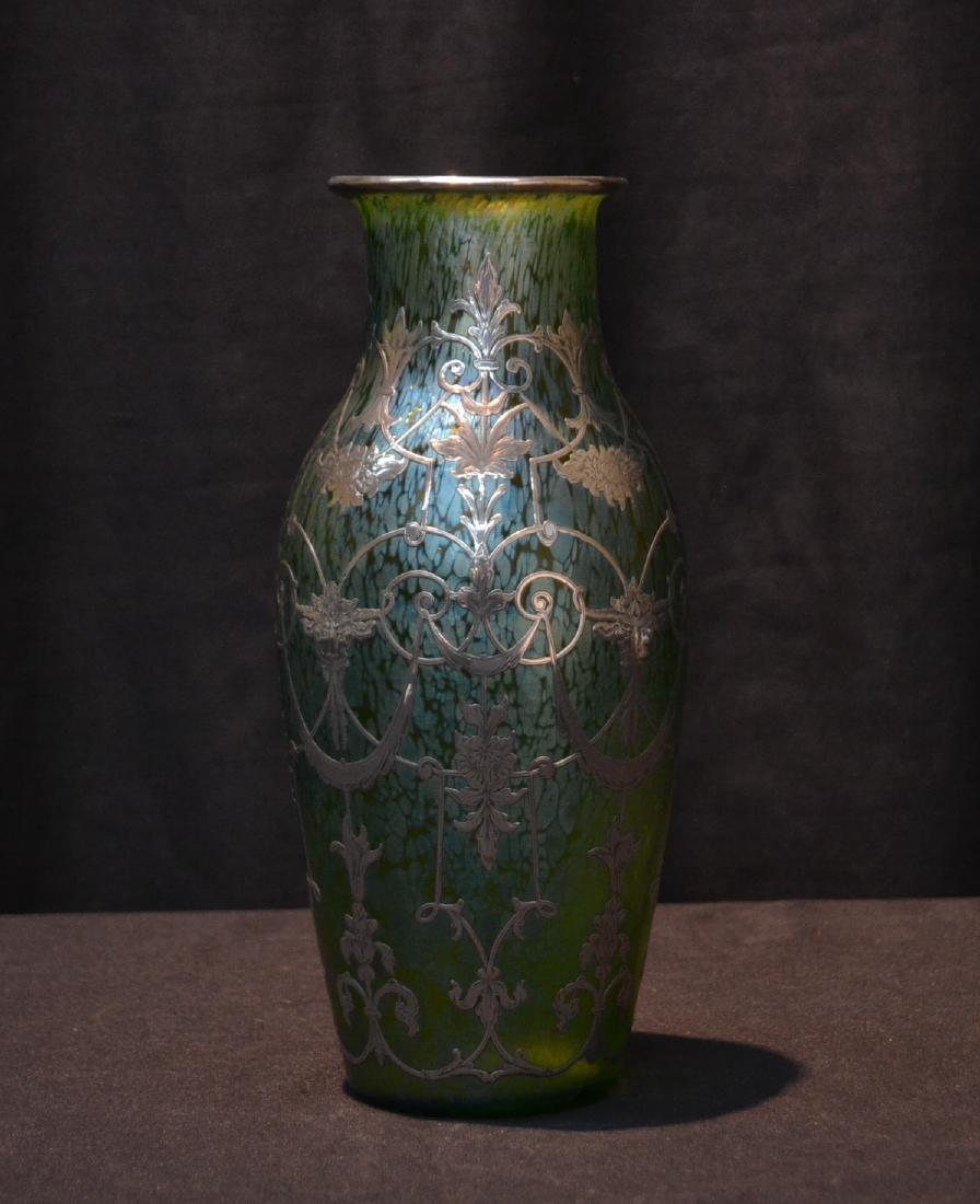 SILVER OVERLAY LOETZ ART GLASS VASE WITH: FINE SILVER OVERLAY GARLANDS , FLOWERS & RAM HEADS OVER IRIDESCENT GREEN ART GLASS VASE - 4" x 9 1/2"