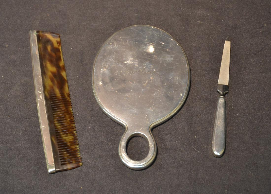 TIFFANY & Co. MAKERS STERLING DRESSER SET: CONSISTING OF MIRROR , COMB & NAIL FILE INSCRIBED "CAROLINE" ; LARGEST PIECE IS 5" x 8"