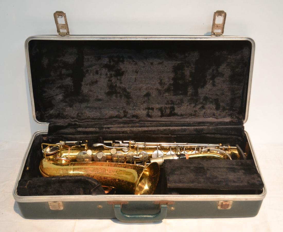 BUNDY SAXOPHONE IN PRESENTATION CASE: (PATINA LOSS) 7 1/2" x 21" WITHOUT MOUTHPIECE
