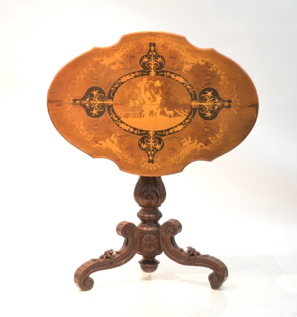 19thC BLACK FOREST TILT TABLE WITH INLAID DEER: MEDALLION & CARVED RAISED EDELWEISS FLOWERS ON BASE - 33" x 22 1/2" x 28"