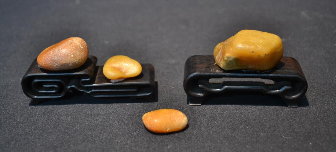 CHINESE TIANHUANG SOAPSTONE PIECES ON STANDS: LARGE STONE IS 3" x 1" x 1 3/4"