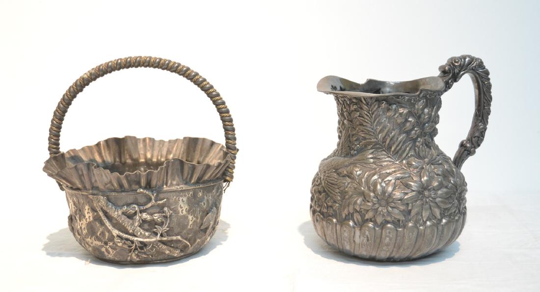 (2) SIMPSON, HALL & MILLER SILVER PLATE PIECES: TO INCLUDE AESTHETIC RUFFLED BASKET & EMBOSSED PITCHER WITH FLOWERS & BIRDS - 8" x 8" & 8" x 6" x 7 3/4"