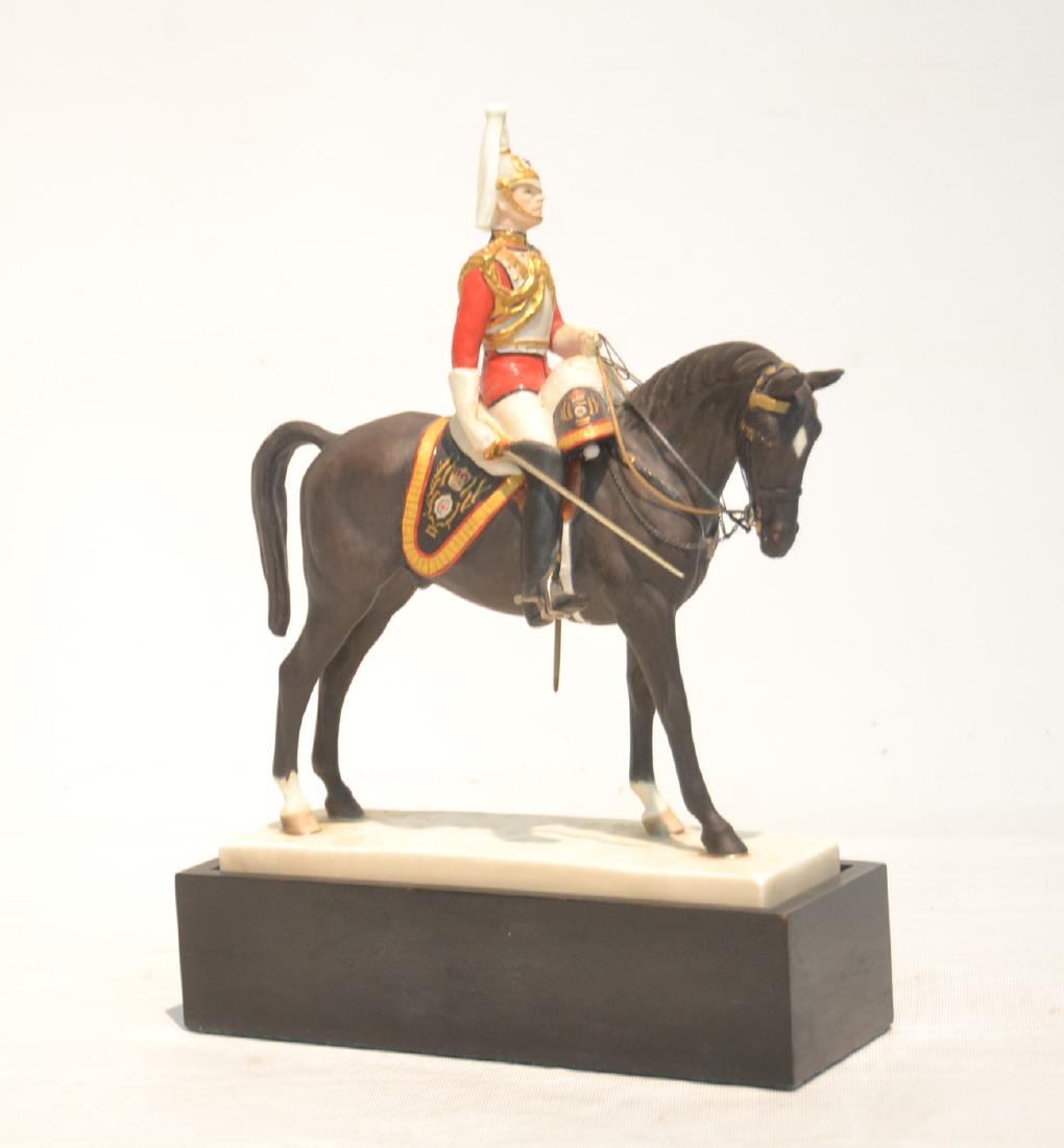 ROYAL WORCESTER "THE LIFE GUARDS" PORCELAIN: FIGURE OF ENGLISH SOLDIER ON HORSE BACK , BY DORIS LINDNER , WITH WOOD STAND - 7" x 2" x 8 1/2" , 10" WITH STAND