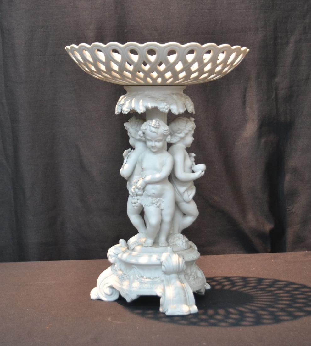 PARIAN PORCELAIN CENTERPIECE WITH: (3) PUTTIS HOLDING RETICULATED BASKET - 11 1/2" x 16"