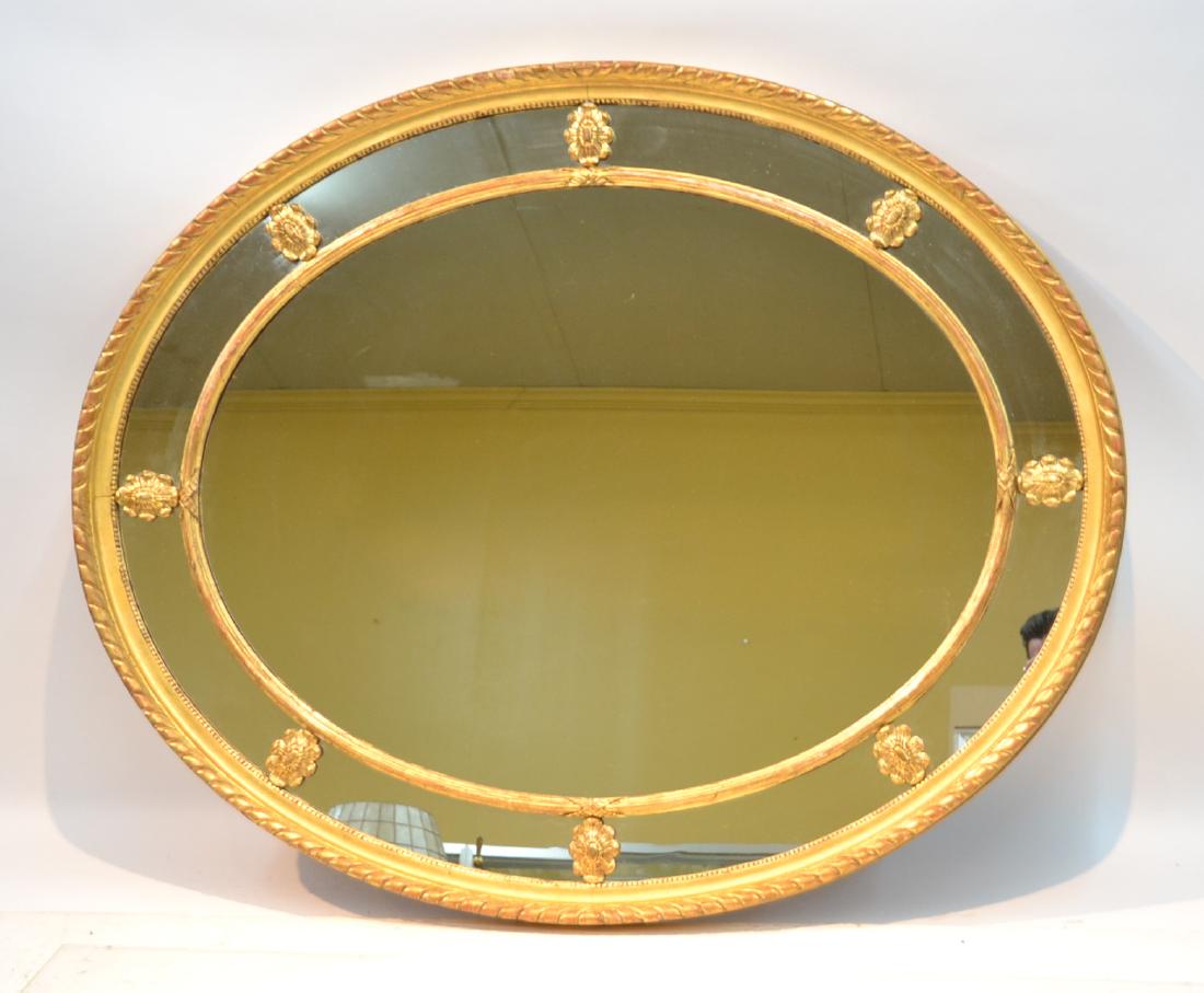 LARGE OVAL GILTWOOD MIRROR WITH FLOWERS: 54" x 44"