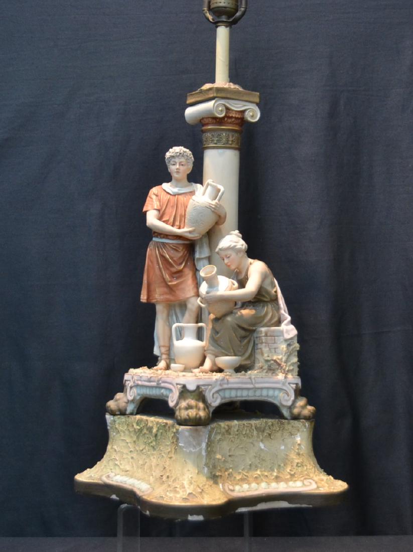 ROYAL DUX FIGURAL LAMP THE "GREEK POTTER": OF MAN & WOMAN PAINTING URNS ; MOUNTED ON PAINTED WOOD BASE - 11" x 11" x 20" , 39" TALL OVERALL