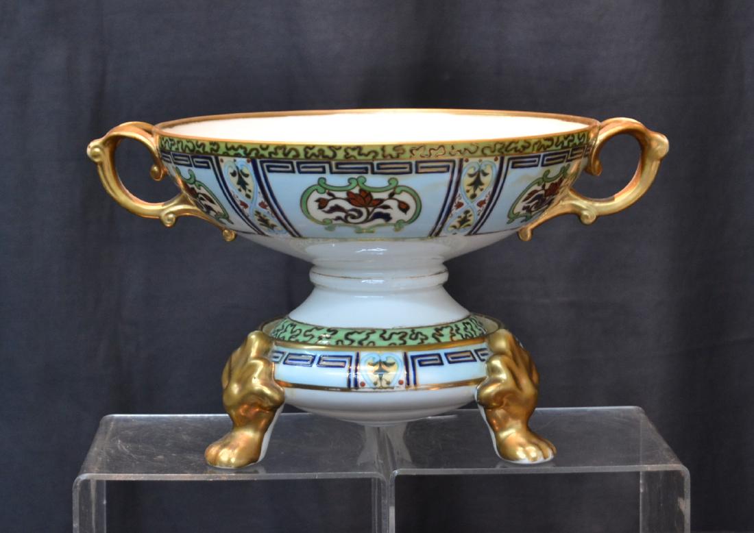 HAND PAINTED NIPPON CENTER BOWL ON STAND: WITH HAND PAINTED FRUIT INTERIOR , ARTIST SIGNED O. MANZO , RAISED ON PAW FOOT STAND - 12" x 6" x 6 3/4" ; WITH 2" PEDESTAL