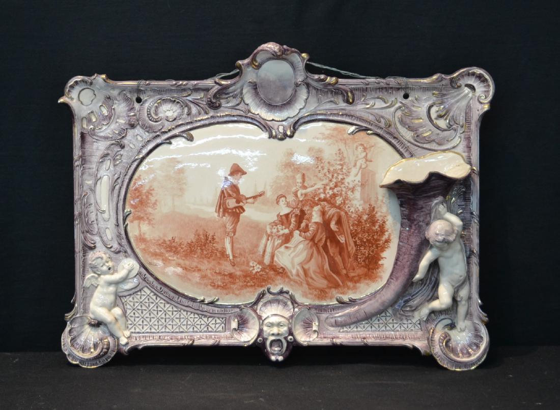 UNUSUAL VILLEROY & BOCH PORCELAIN PLAQUE: LARGE VILLEROY & BOCH PORCELAIN PLAQUE WITH HAND PAINTED SCENE OF MAN SERENADING LADY WITH PUTTI & WALL POCKET EPERGNE ON SIDE - MARKED V & B , M 6025-32 , 2353 - 23" x 17 1/2"