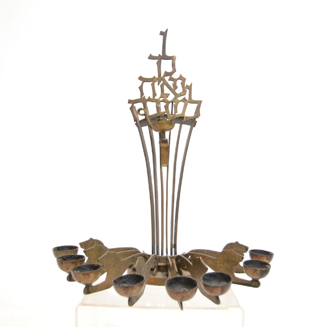 LUDWIG WOLPERT , UNUSUAL BRONZE CHANUKAH LAMP: BEZALEL SCHOOL , JUDAICA BRONZE CHANUKAH LAMP BY LUDWIG WOLPERT , SCULPTURE WITH LIONS HOLDING CUPS, SIGNED WOLPERT - 11 1/2" x 5 1/2" x 13"(SOME PATINA DULLING)