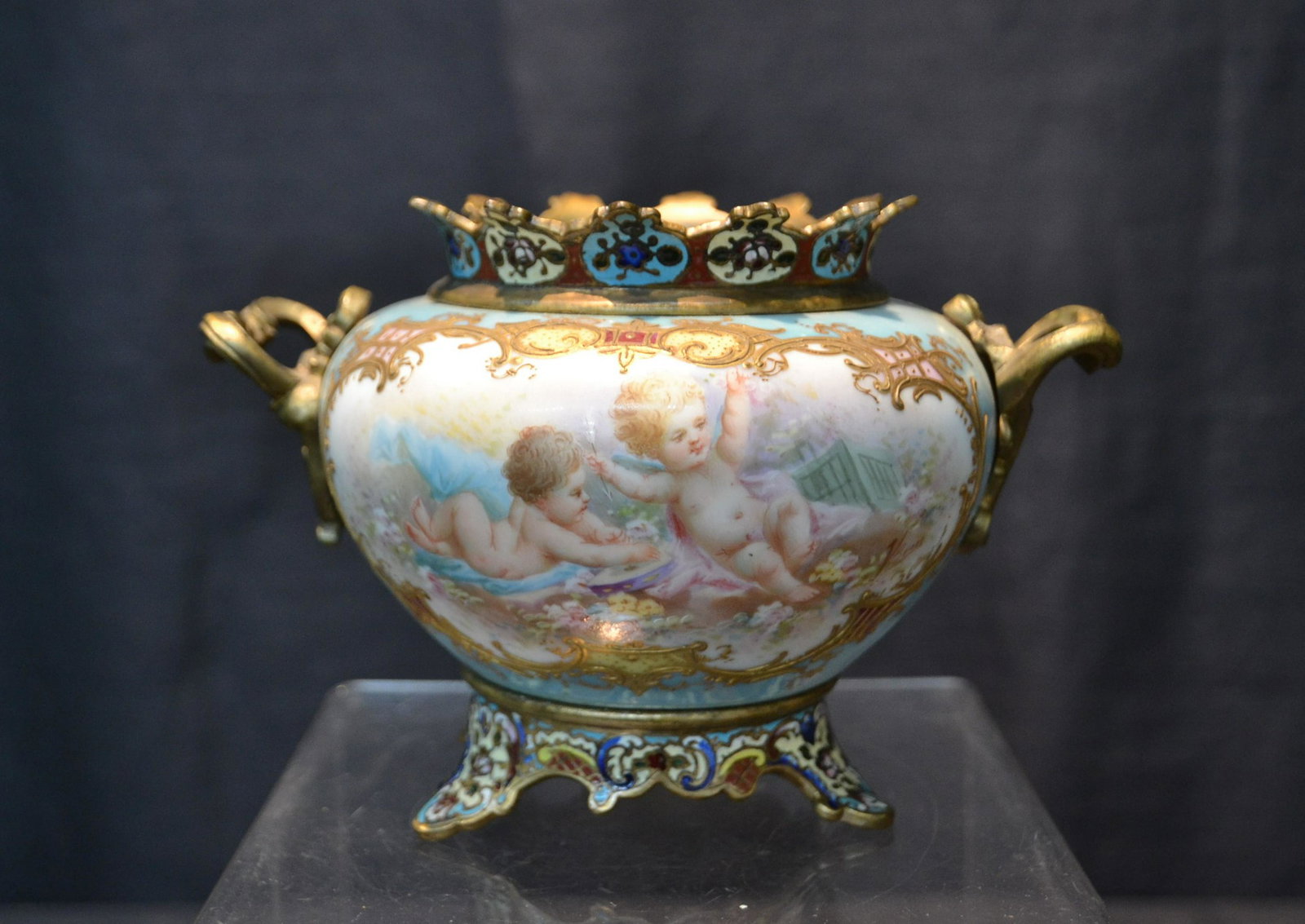 LUSTRE GROUND SEVRES PORCELAIN & BRONZE BOWL: HAND PAINTED SEVRES PORCELAIN & CHAMPLEVE BRONZE MOUNTED BOWL WITH PUTTI & FLORAL MEDALLIONS - 7" x 5" x 4 1/2"