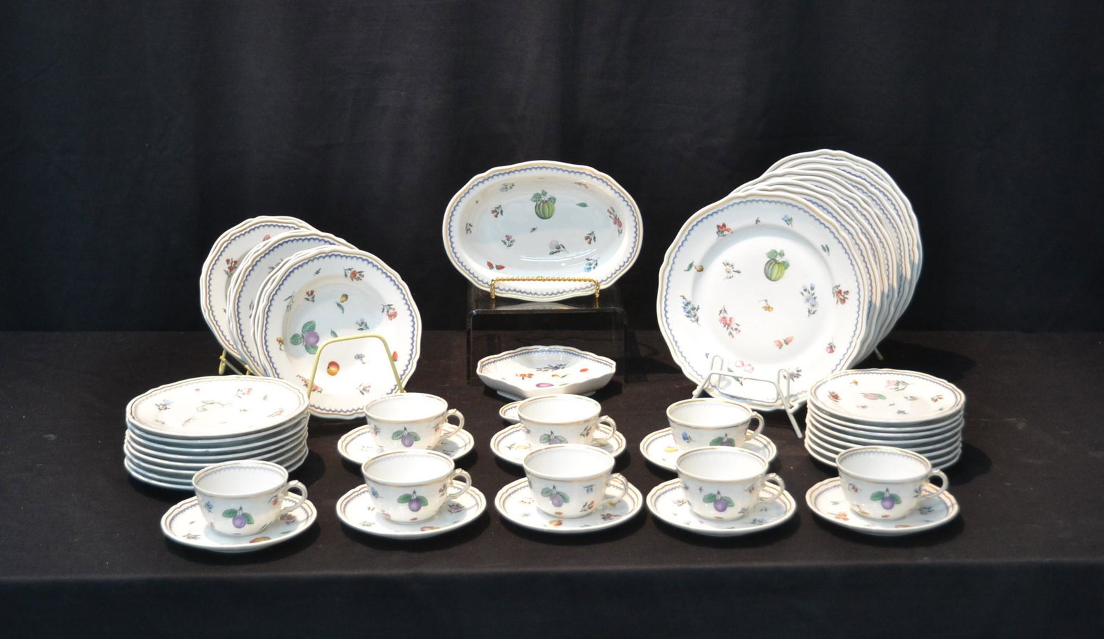 GINORI PORCELAIN CHINA DINNER SERVICE: WITH FLOWERS & FRUIT CONSISTING OF (8) DINNER PLATES , (8) SOUP BOWLS, (8) CUPS & SAUCERS , (8) DESSERT PLATES , (8) BREAD PLATES , VEGTABLE DISH, BON BON DISH & BUTTER DISH
