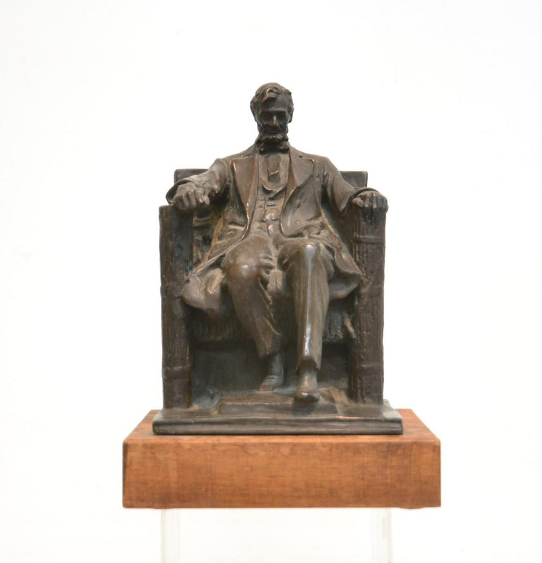DANIEL CHESTER FRENCH (AMERICAN, 1850-1931): PLASTER SEATED ABRAHAM LINCOLN , SIGNED DC FRENCH , 1915 , ON WOOD BASE - 8" x 8" x 12"