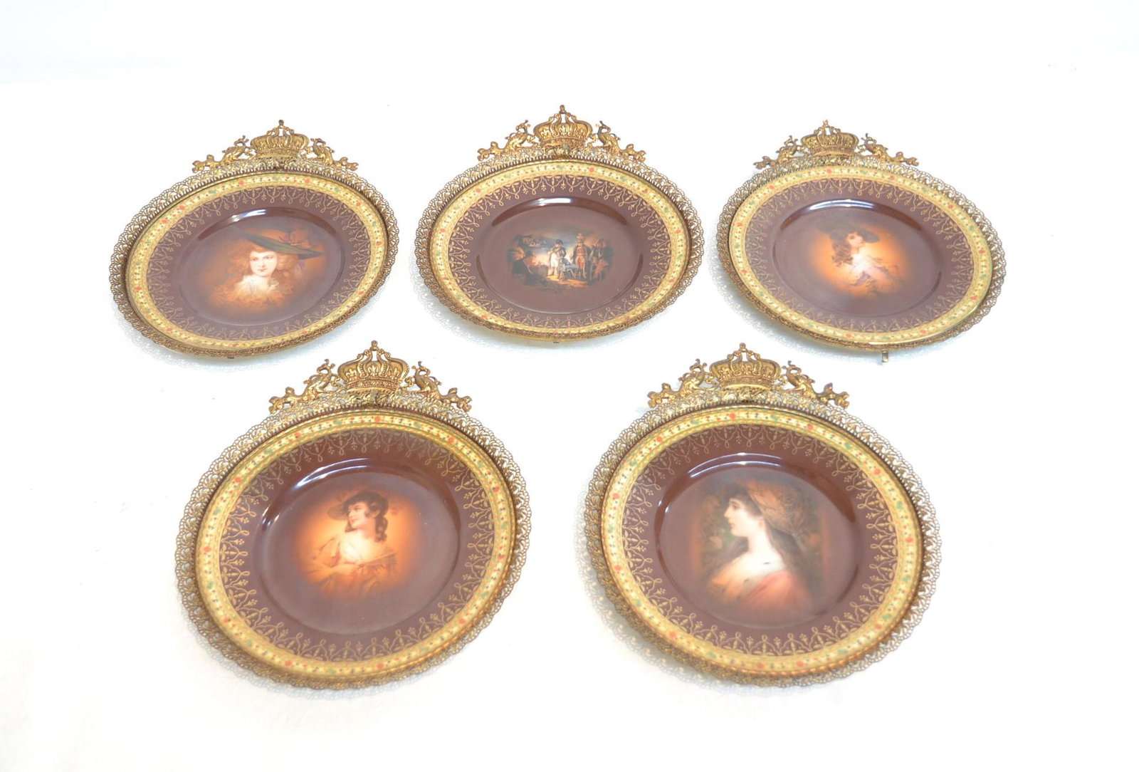 (5) CARLSBAD PORCELAIN & ORMOLU MOUNTED PLATES: (5) CARLSBAD PORCELAIN PLATES WITH PORTRAITS OF WOMAN & (1) NAPOLEON BATTLE SCENE , WITH FRENCH GILT ORMOLU MOUNTS WITH CROWN & PEACOCKS - 8 1/2" x 9 3/4" OVERALL
