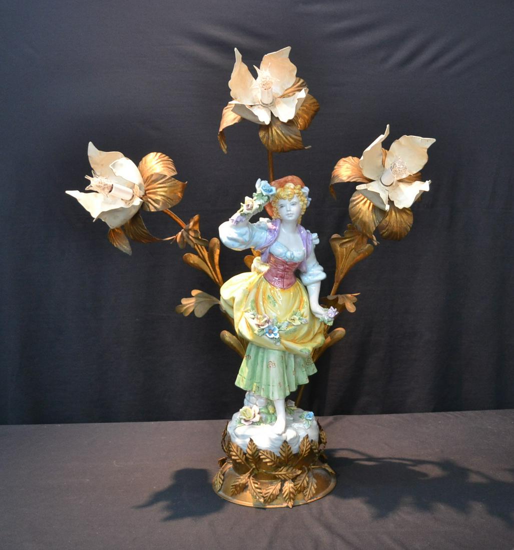 LARGE CAPODIMONTE PORCELAIN & TOLE LAMP: LARGE CAPODIMONTE PORCELAIN FIGURE OF GIRL WITH FLOWERS SURROUNDED BY TOLE FOLIATE LIGHTS & MOUNTED ON TOLE BASE - 26" x 15"x 34"