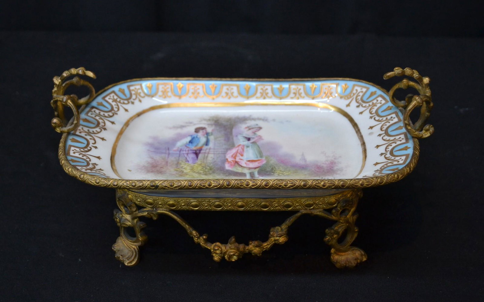 FRENCH SEVRES BRONZE MOUNTED DISH: WITH ROMANTIC SCENE & GOLD DECORATIONS , ARTIST SIGNED PETIT WITH BRONZE HANDLES & BASE - 18" x 4" x 9 1/2
