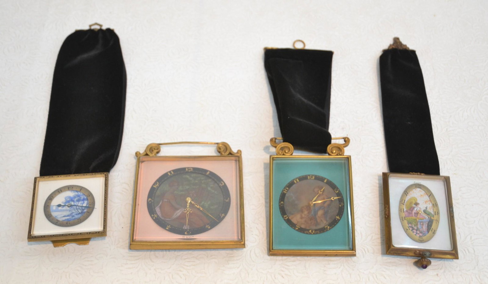 (4) ANTIQUE TRAVEL CLOCKS INCLUDING: HAND PAINTED CHERUBS / 8-DAY HAND PAINTED MOTHER OF PEARL CLOCK / ARTIST SIGNED 8-DAY CLOCK & SWISS 8-DAY TRAVEL CLOCK WITH LANDSCAPES - LARGEST IS 4" x 5"