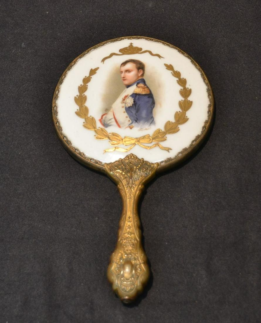 NAPOLEON PORCELAIN & GILDED METAL HAND MIRROR: GILDED METAL HAND MIRROR WITH PORCELAIN MEDALLION HAVING PORTRAIT OF NAPOLEON - 5 1/2" x 9 1/2"