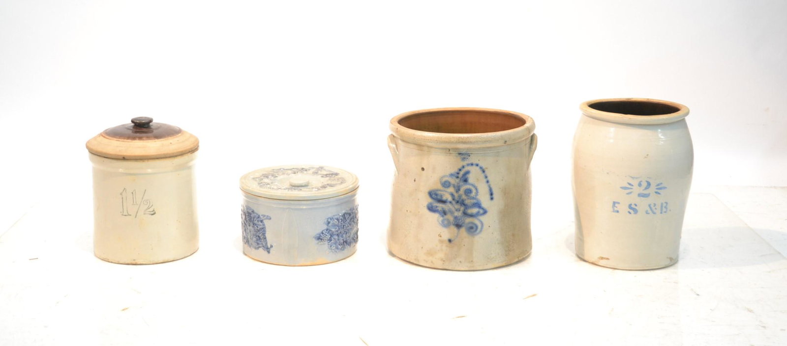 STONEWARE LOT INCLUDING 4 GALLON STONEWARE: CROCK WITH COBALT FLOWERS (HAS CHIPS ON BOTTOM) , ROBINSON CLAY PRODUCTS SALT GLAZE COVERED CHEESE DOME ,2 GALLON ES & B CROCK - LARGEST IS 12" x 10 1/2"