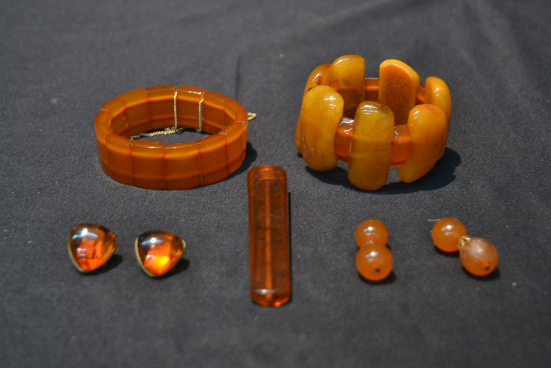 AMBER BAKELITE JEWELRY INCLUDING (2) BRACELETS ,: CIGARETTE HOLDER , (Pr) EARRINGS & (Pr) CUFFLINKS
