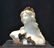 WHITE ALABASTER BUST OF WOMAN SURROUNDED