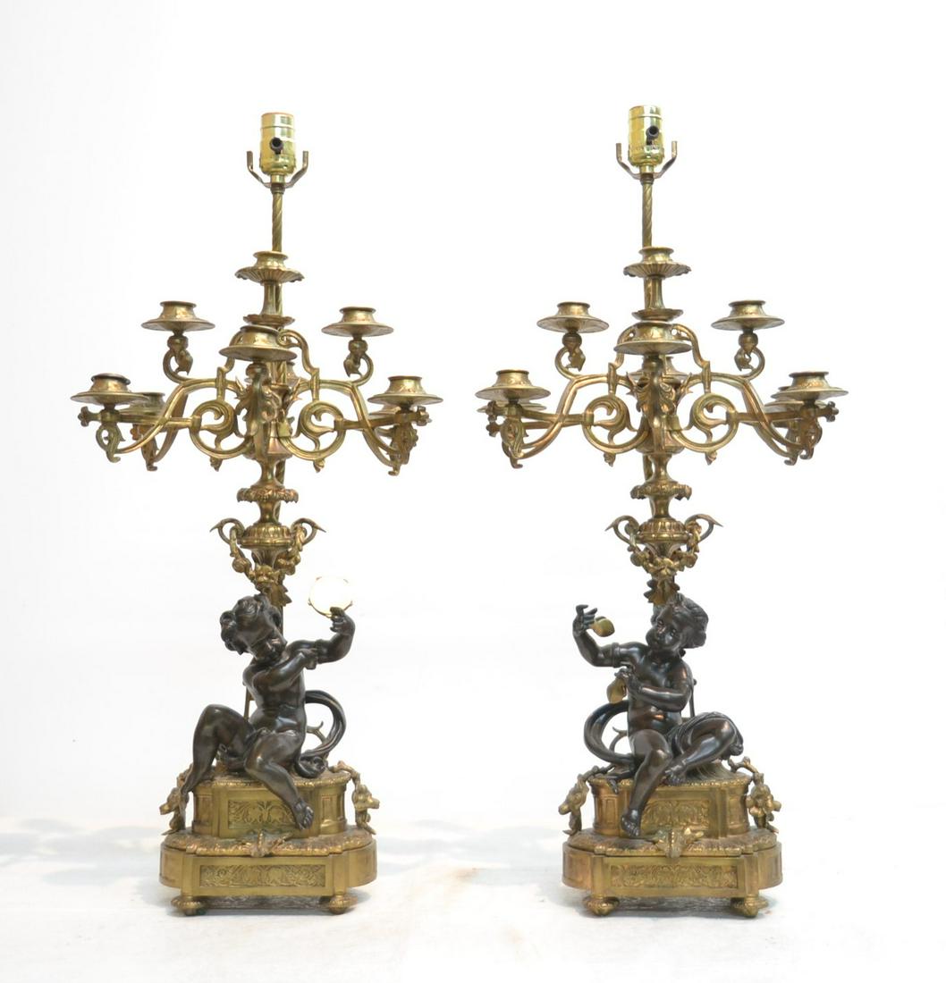 (Pr) DORE & PATINATED BRONZE CANDELABRAS: WITH SEATED PUTTIS ON BASE HOLDING (9) CANDLE BRANCHES ; MOUNTED AS LAMPS - 8" x 6" x 29"