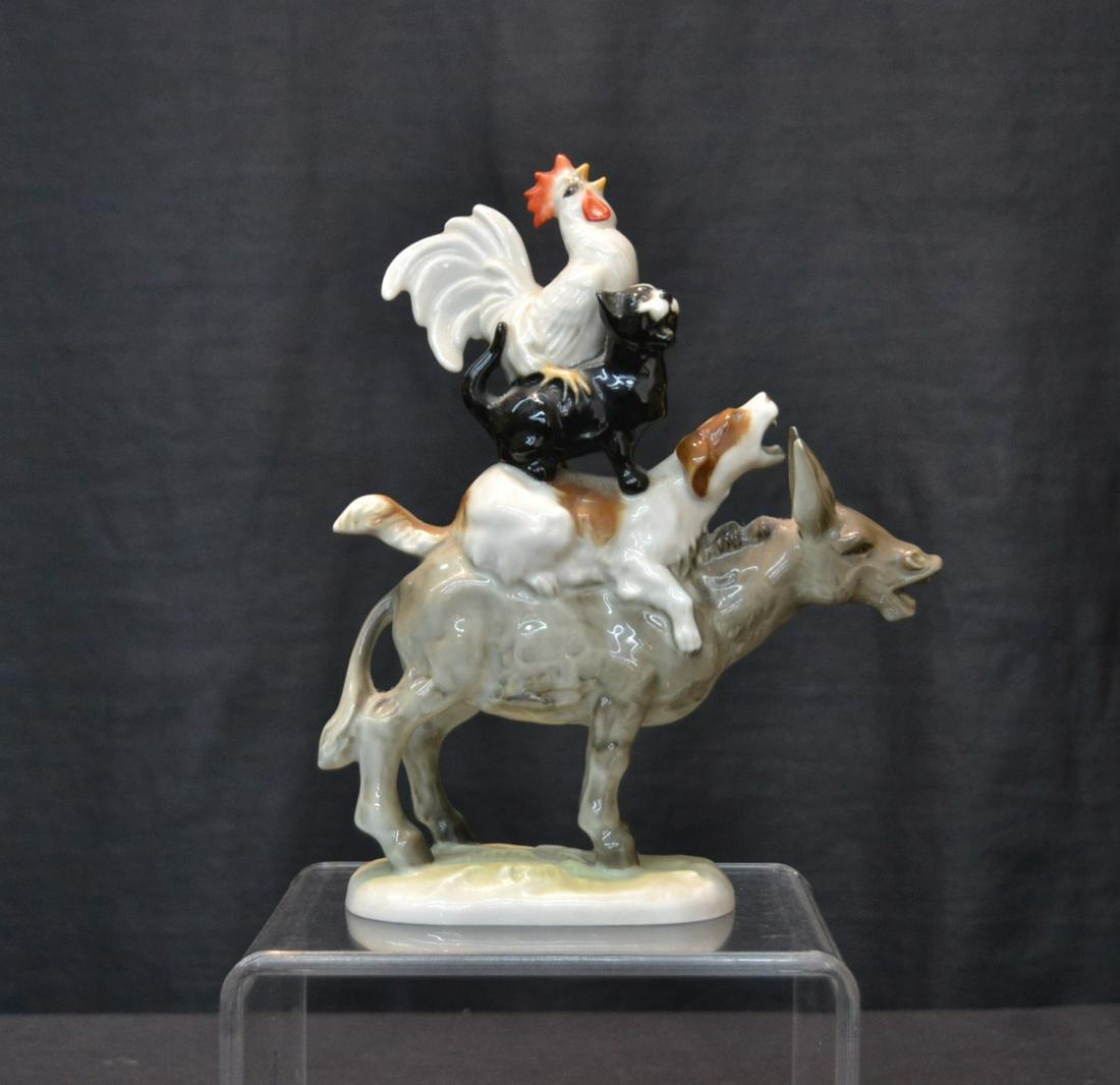 HUTSCHENREUTHER PORCELAIN ANIMAL GROUPING: BREMEN TOWN MUSICIANS OF ROOSTER , CAT & DOG ON TOP OF DONKEY - 5 1/2" x 2 1/2" x 7 1/2"