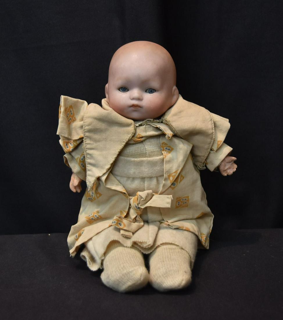 GERMAN BISQUE SOLID DOME HEAD BABY DOLL: GERMAN BISQUE BABY DOLL , 1925 3/0 , WITH BROWN SLEEP EYES ; WITH CLOTH BODY - HEAD IS 7 1/2" ; 10" TALL OVERALL