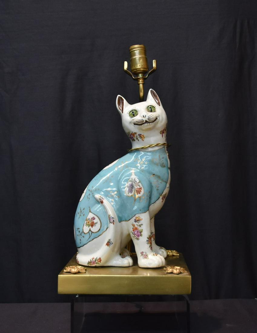 LARGE ENGLISH PORCELAIN CAT: LARGE ENGLISH PORCELAIN CAT MOUNTED TO BRONZE LAMP , POSSIBLY BY EMPIRE WORKS STOKE ON TRENT ENGLAND - CAT IS 7 1/2" x 4 1/2' x 13" ; OVERALL IS 9" x 9" x 18" (CAT HAS CRACK ON BACK LEG)
