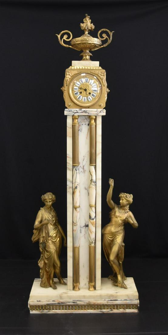 UNUSUAL LARGE FRENCH MARBLE & BRONZE TOWER CLOCK: UNUSUAL FRENCH MARBLE & BRONZE TOWER FORM CLOCK WITH MARTI MEDAILLE FRENCH MOVEMENT WITH TWIN HANDLE URN ATOP & HAVING LARGE GILT PATINATED NEO CLASSICAL FIGURES ASIDE TOWER - 19" x 8" x 51" TALL