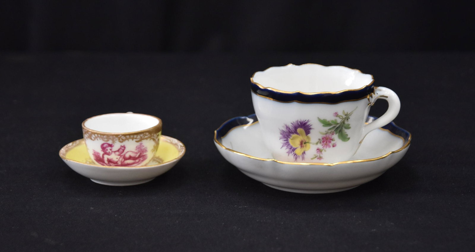 (2) MEISSEN PORCELAIN CUPS & SAUCERS: MEISSEN PORCELAIN CUP & SAUCER / MINIATURE MEISSEN PORCELAIN CUP & SAUCER - LARGEST IS 4 1/2" x 2 1/2"