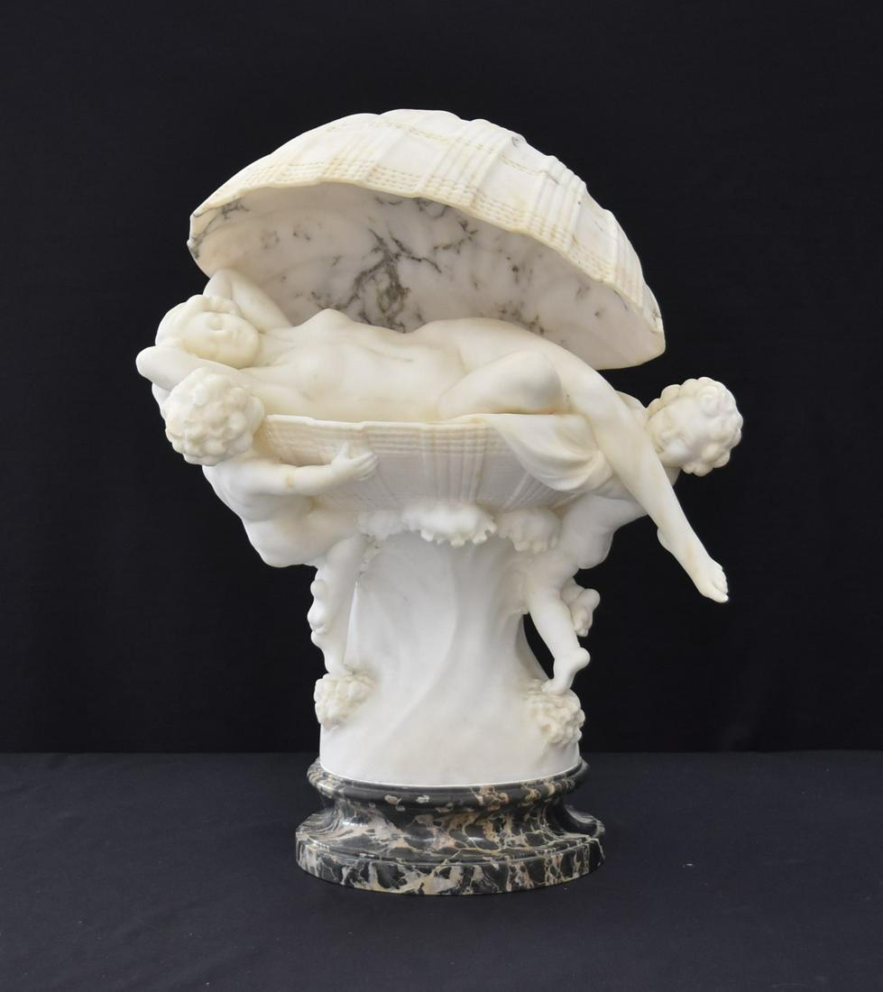 ART NOUVEAU ALABASTER FEMALE NUDE LAYING: IN OPEN SEA SHELL WITH PUTTI HOLDING UP SHELL , ON MARBLE BASE - 18" x 13"