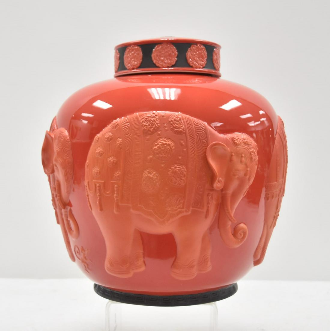 LARGE JEAN BOGGIO FOR FRANZ COVERED URN: LARGE CORAL GROUND PORCELAIN COVERED URN WITH RAISED ELEPHANTS , SIGNED JEAN BOGGIO FOR FRANZ - 14" x 14 1/2"