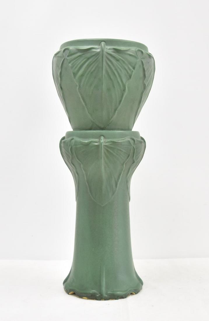 WELLER "ELEPHANT EAR" JARDINERE & PEDESTAL: WELLER POTTERY MATTE GREEN GROUND JARDINIERE & PEDESTAL "ELEPHANT EAR" PEDESTAL WITH CONJOINED RELEIF ELEPHANT EAR DESIGNS - JARDINERE 12" x 11 12" (SMALL HAIRLINE ON BASE) ; PEDESTAL 11" x 20 1/2" ; 