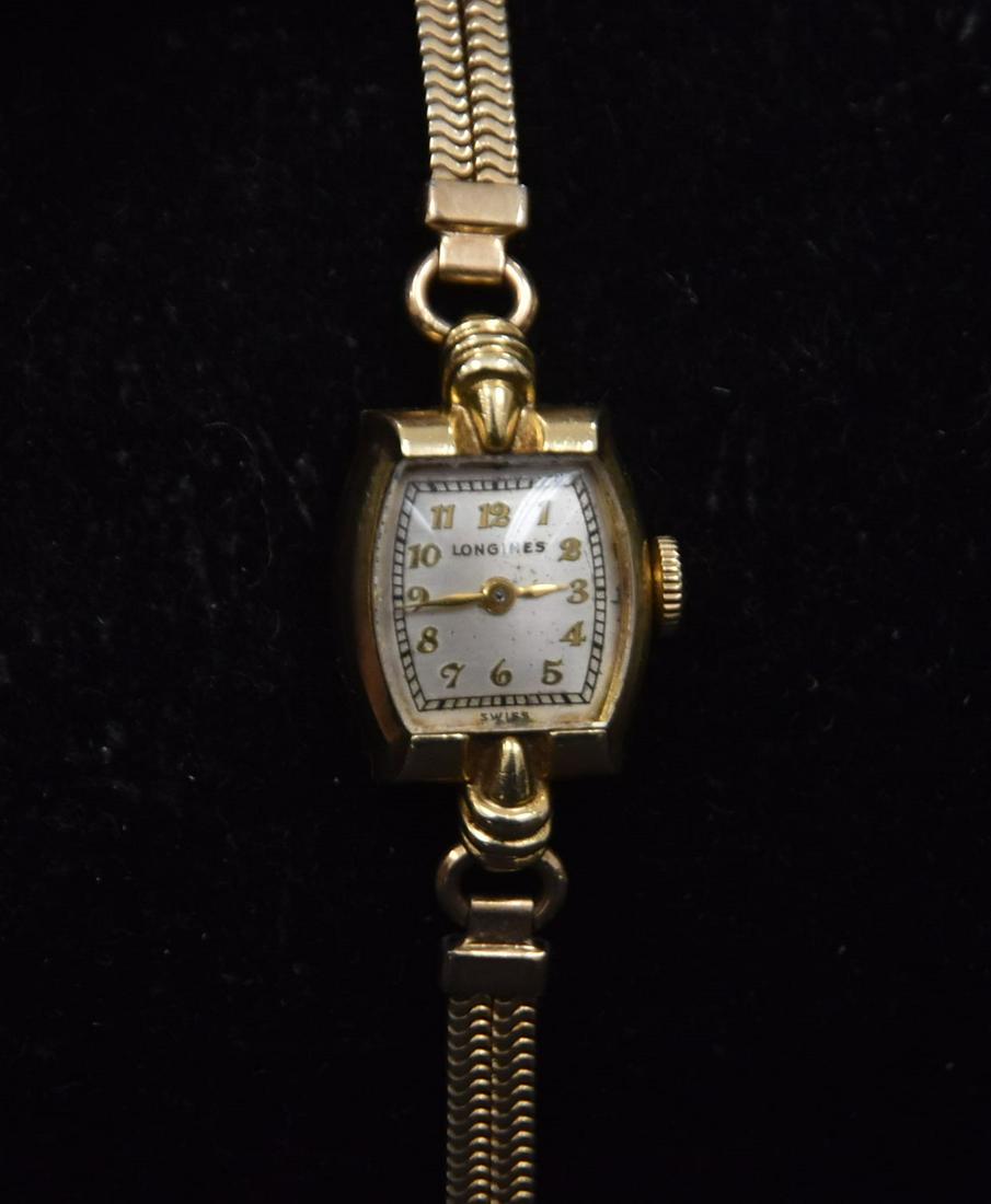 14kt GOLD LONGINES WATCH: VINTAGE 14kt GOLD LONGINES WATCH WITH 14kt GOLD FACE - 5/8" ; BAND IS NOT GOLD - 2 3/4" CIRCUMFERENCE