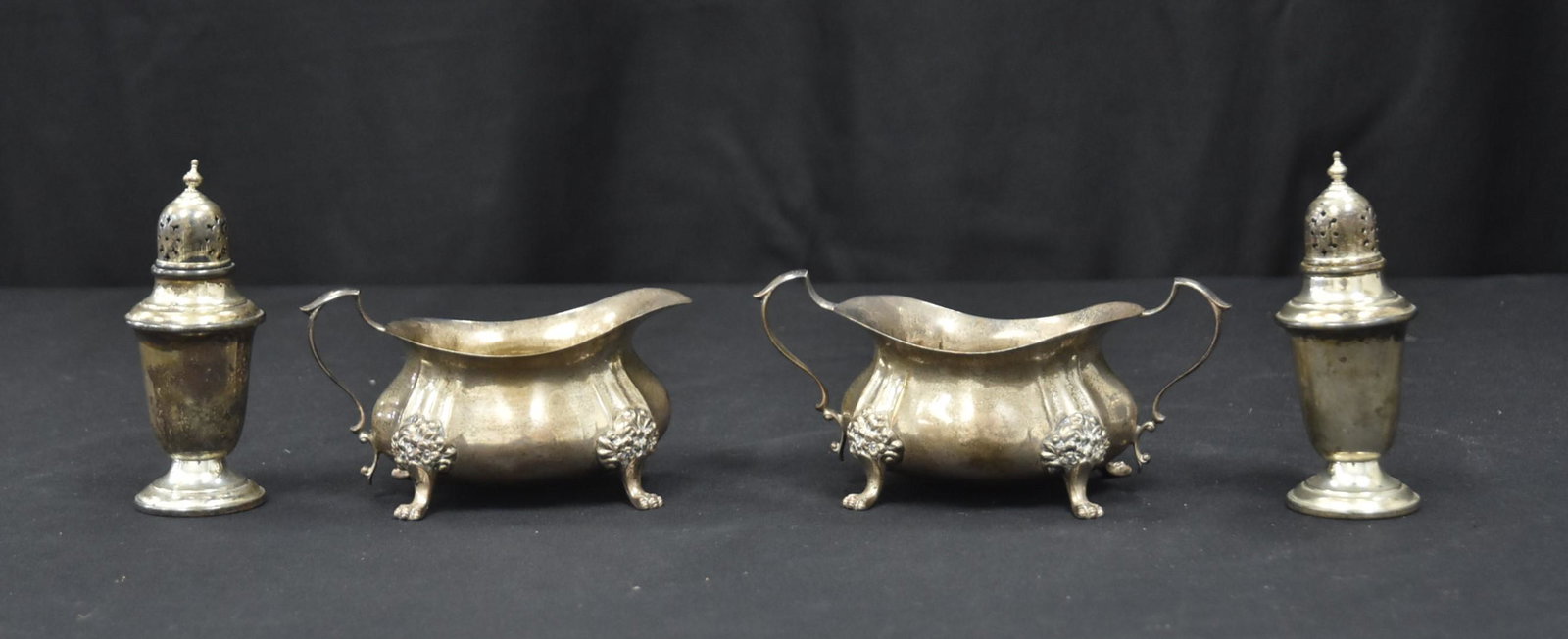 (4)pc STERLING SILVER TABLEWARE INCLUDING: (Pr) POOLE STERLING SILVER GEORGIAN PATTERN SUGAR & CREAMER WITH PAW FEET & (Pr) GORHAM STERLING SILVER SALT & PEPPER SHAKERS - 13.06ozt ; LARGEST IS 6" x 3"