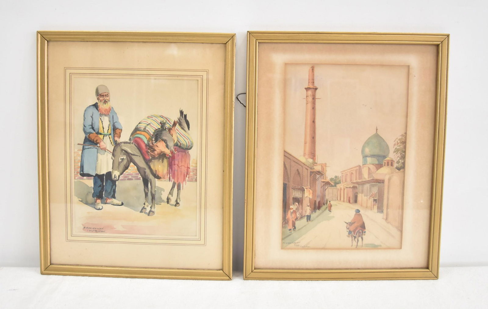 (2) ANTIQUE PERSIAN WATERCOLORS: MISHA CHAHBAZIAN (TEHRAN, 1904-1976) WATERCOLOR ISFAHAN VILLAGE , SIGNED M CHAHBAZIAN , 1948 / ED. BARSEGHIAN , TEHRAN WATERCOLOR OF MAN WITH DONKEY , SIGNED E. E.. BARSEGHIAN- 7 1/2" x 11 1/4" ; 12"