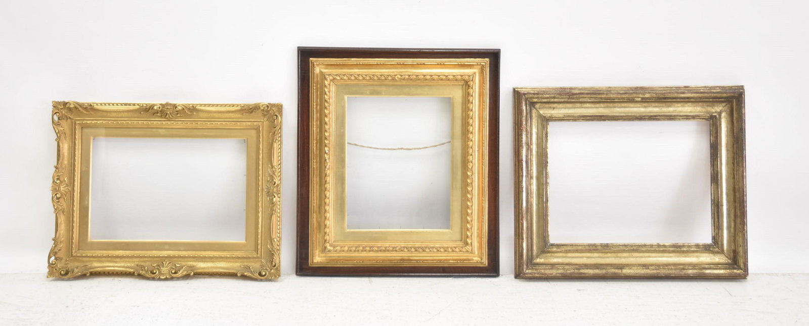 (3) ANTIQUE GILTWOOD FRAMES INCLUDING: GIUSEPPE SALVESTRINI GILTWOOD FRAME - 23" x 17 1/2" ; OPENING 16" x 10 3/4" ; CARVED GILTWOOD FRAME 20 1/2" x 23" ; OPENING IS 11" x 14" ; SILVERED FRAME 19 1/2" x 23 1/2" ; OPENING IS 13 1/2" x 17 3/