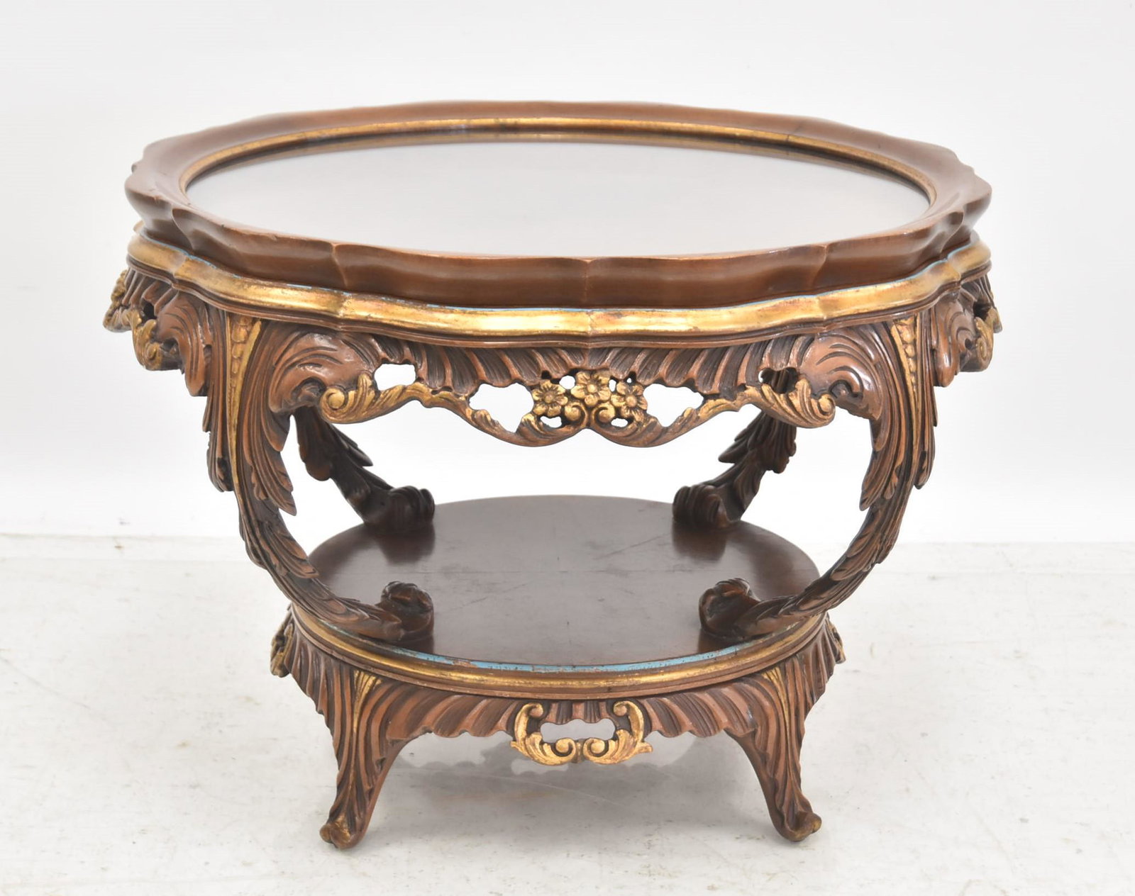 ROUND BURLED WOOD GLASS TOP TEA TABLE: BURLED GLASS TOP ROTATING TEA TABLE WITH PIERCED CARVINGS - 26" x 18"