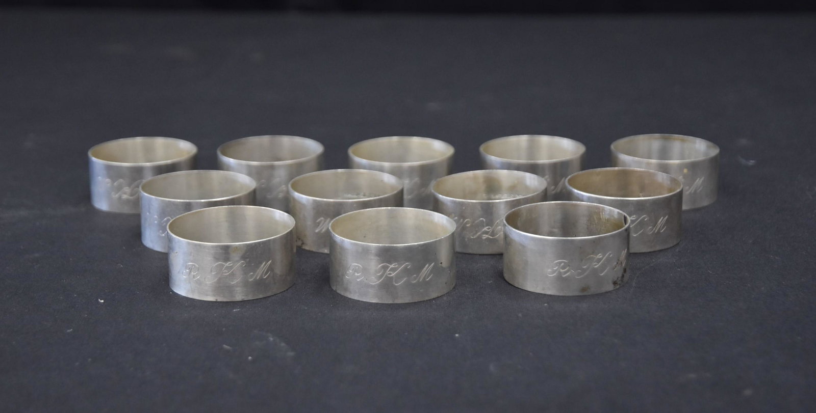 (12) WALLACE STERLING SILVER NAPKIN RINGS: MONOGRAMED RKM , 3/4" x 1 1/2" ; 7.10ozt