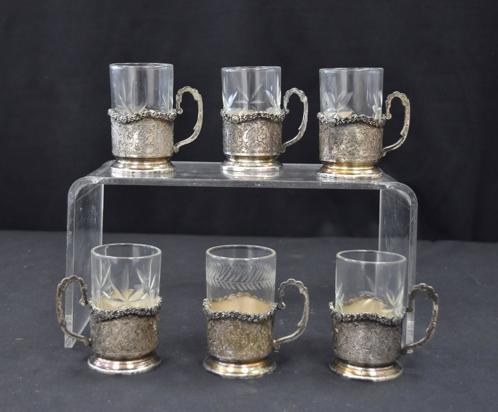 (6) ENGRAVED PERSIAN SILVER TEA CUPS: WITH GLASS LINERS (ONE LINER REPLACED) 354.1grams