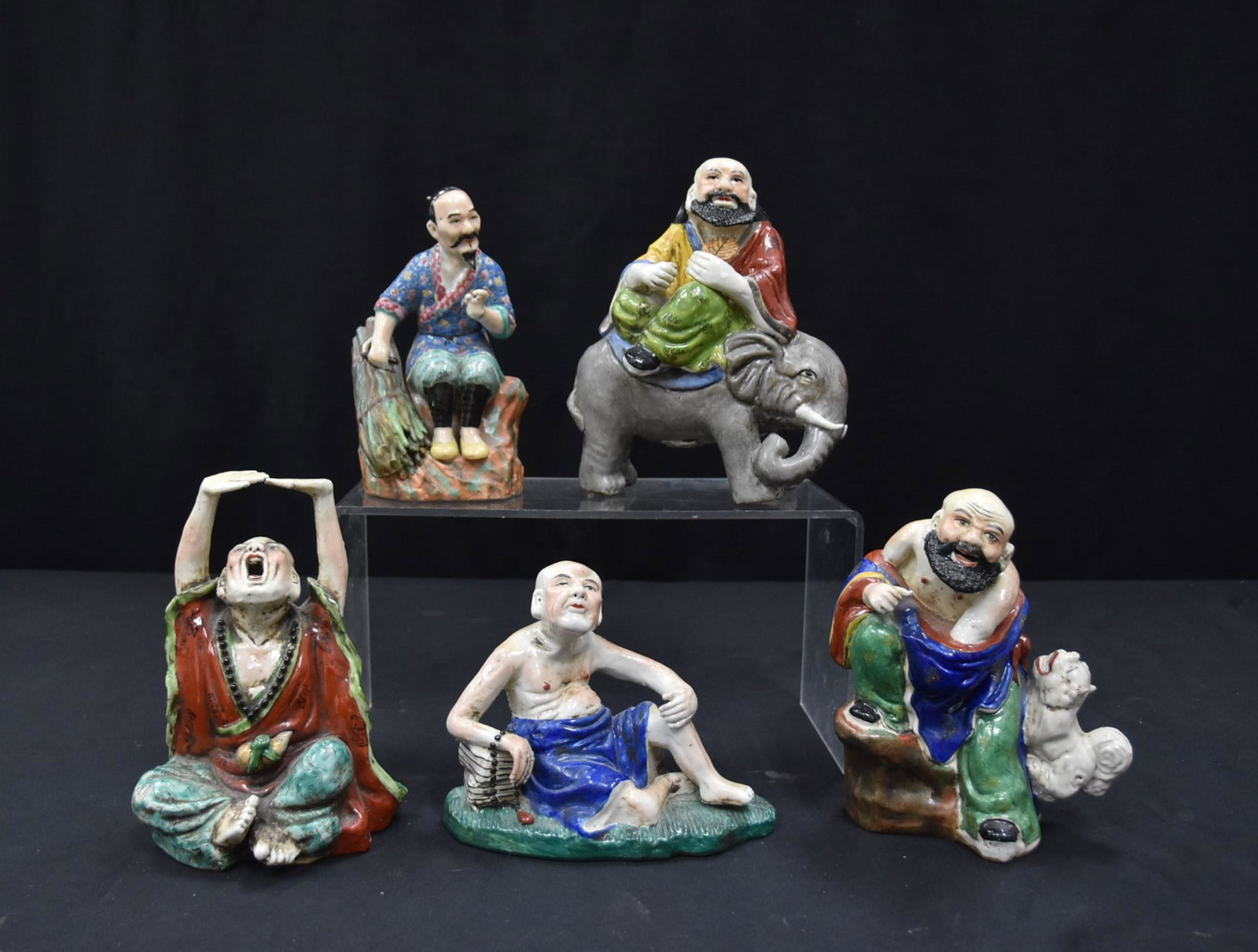 (6) CHINESE EARTHENWARE FIGURINES: INCLUDING MAN ATOP ELEPHANT - LARGEST IS 6" x 3" x 7 1/2"