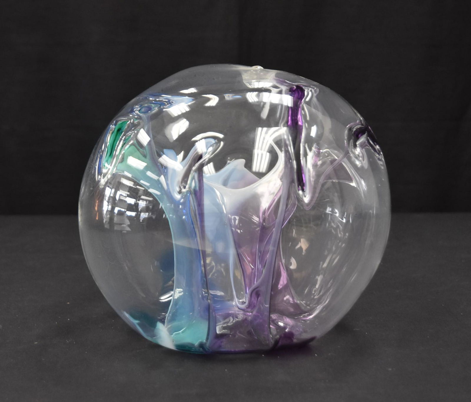 PETER BRAMHALL (VERMONT,b. 1942) ART GLASS SPHERE: FROM THE "NIGHT SNOW SERIES" OF MONUMENTAL CLEAR GLAS SPHERE OVER MULTI COLORED FREE FORM ABSTRACT ELEMENTS INTERNALLY STRUCTURED & DECORATED SIGNED PETER BRAMHALL , JULY 1997 - 8" x 8"