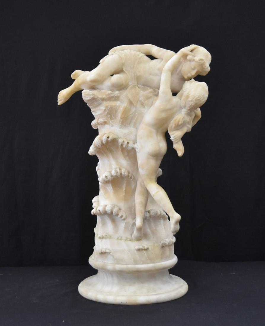 LARGE ALABASTER GROUPING OF VENUS & WINGED CUPID: CARVED ALABASTER SCULPTURE OF VENUS & WINGED CUPID LAYING ON ROCK - 12" x 29" (GLUED LEG & MISSING WINGS)